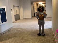 Black girl flashes her pierced nipples in an elevator