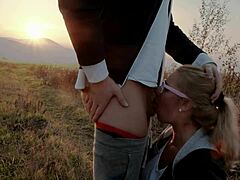 Watch a beautiful blonde babe give a deepthroat blowjob in public during sunset