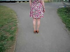 wife walks around the street in her cute summer dress
