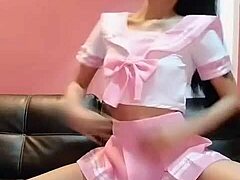Satin-clad Thai babe fingers her tight pussy